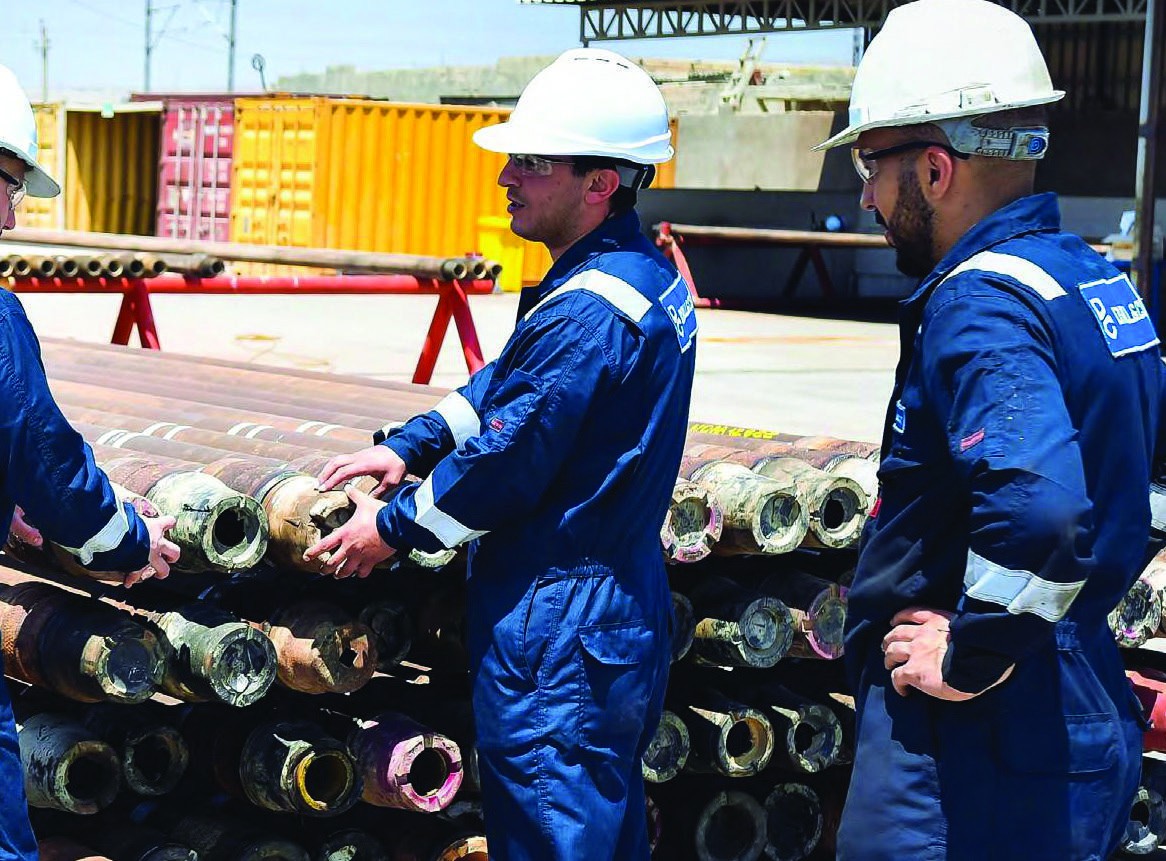 Drill & Cut technicians inspecting tubulars in the yard